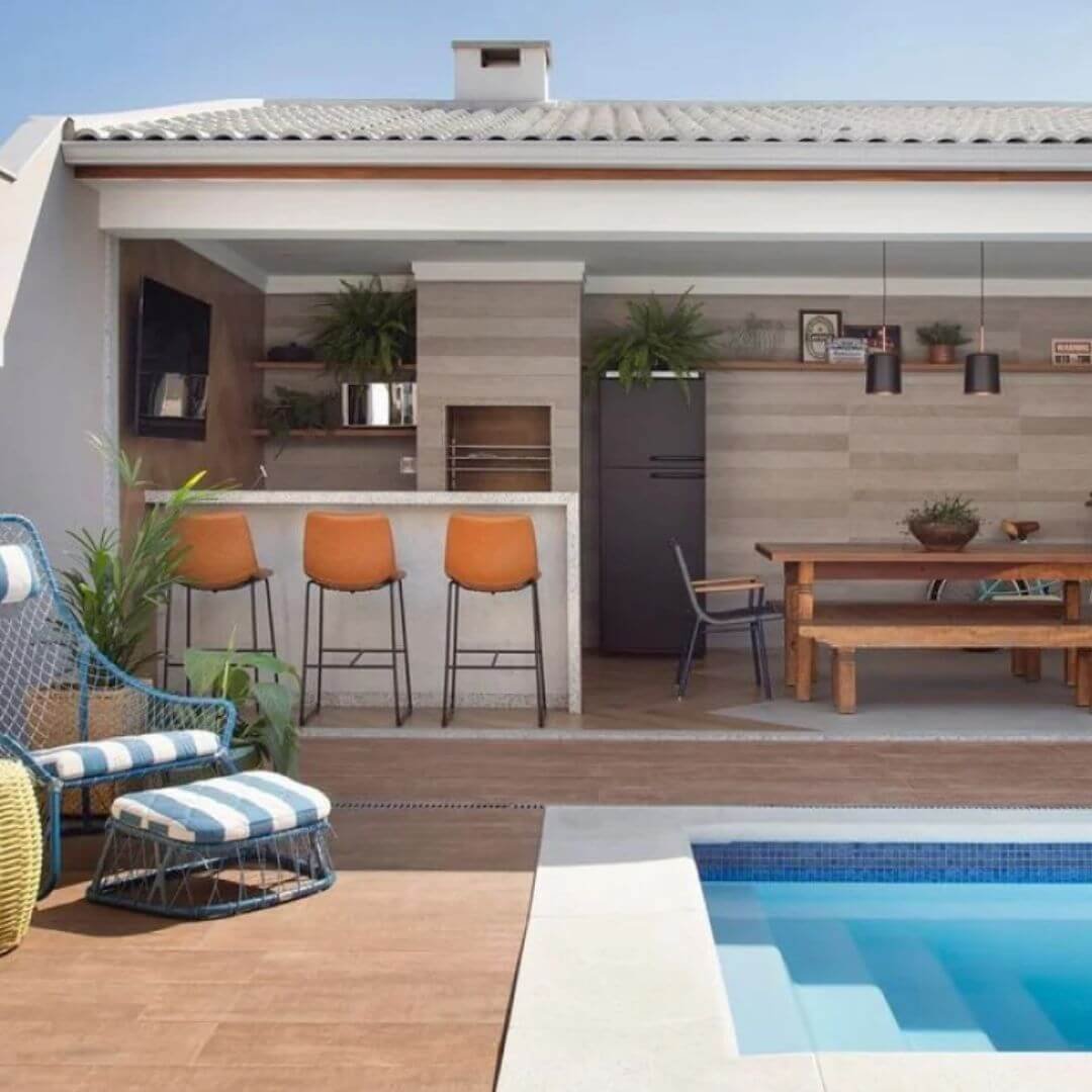decoração área gourmet com piscina e churrasqueira